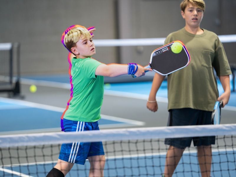 Brothers playing pickleball